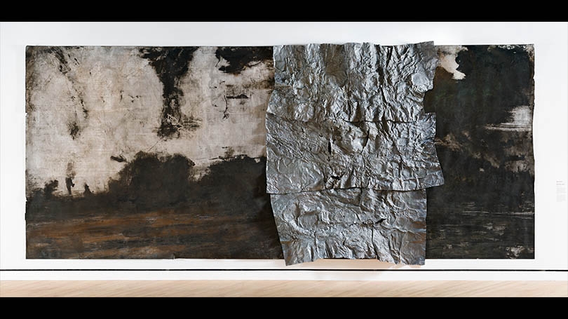dark painting with sculptural element over the surface