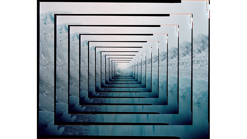 An image of a glacier cut into 1 inch square perimeters and nested within each other to give a tunnel effect. Mostly blue and white, with a thin black line separating the images.