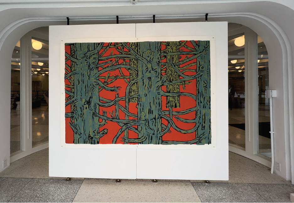 A large-scale painting in the Barrows Rotunda, depicting green tree-like figures over a bright red background.